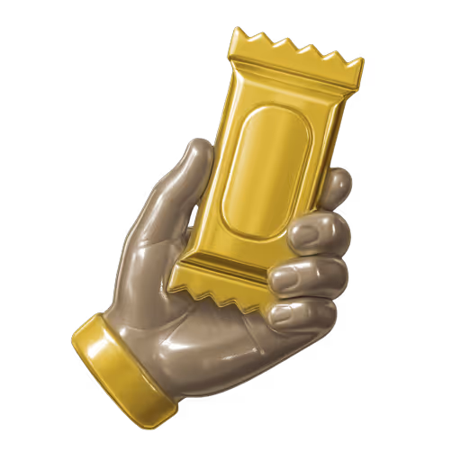 Metallic hand holding a gold-colored wrapper with a blank oval label on a dark brown background.